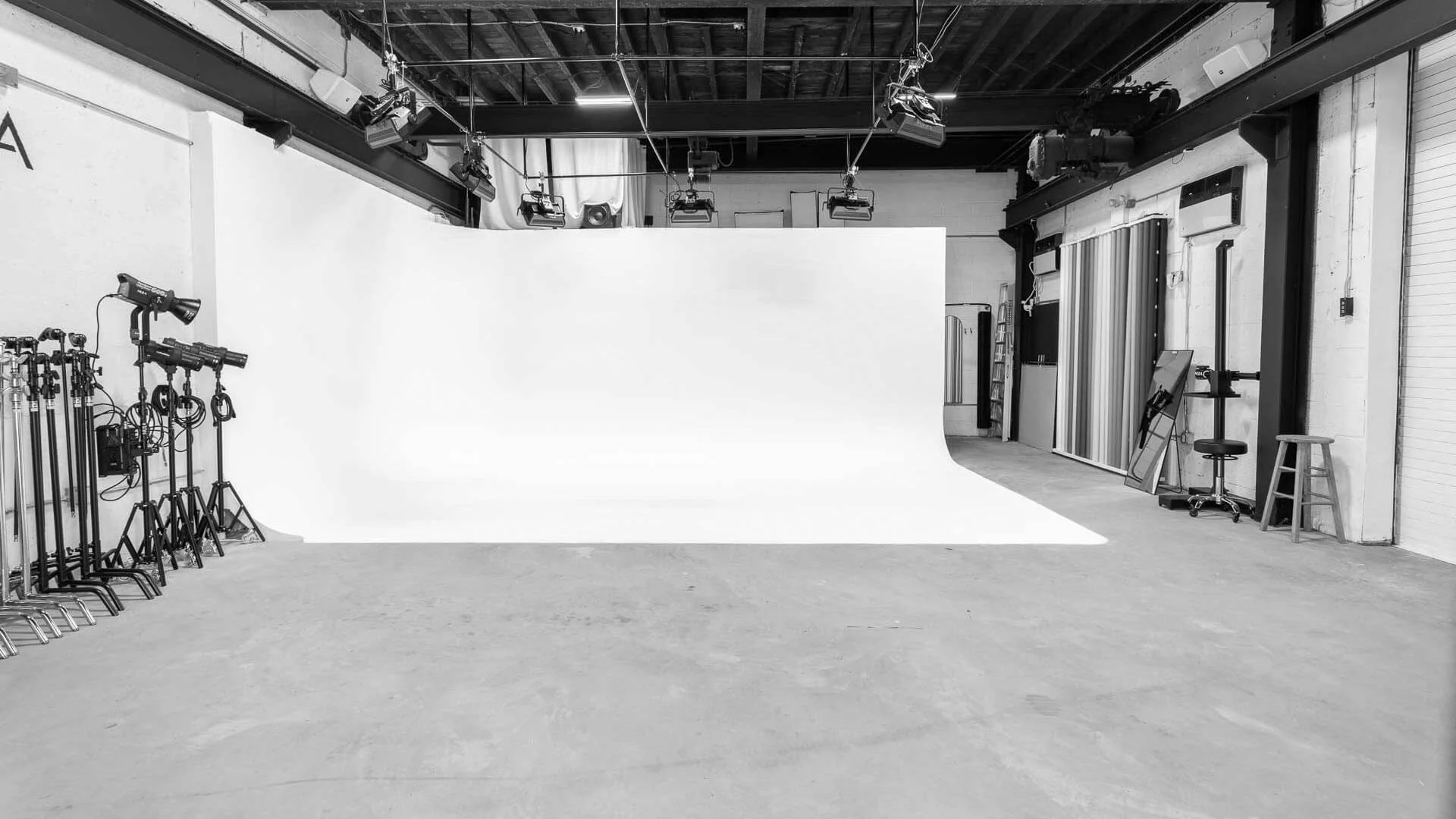 Studio J — Drive in cyc wall studio for seamless, infinite-background shots.